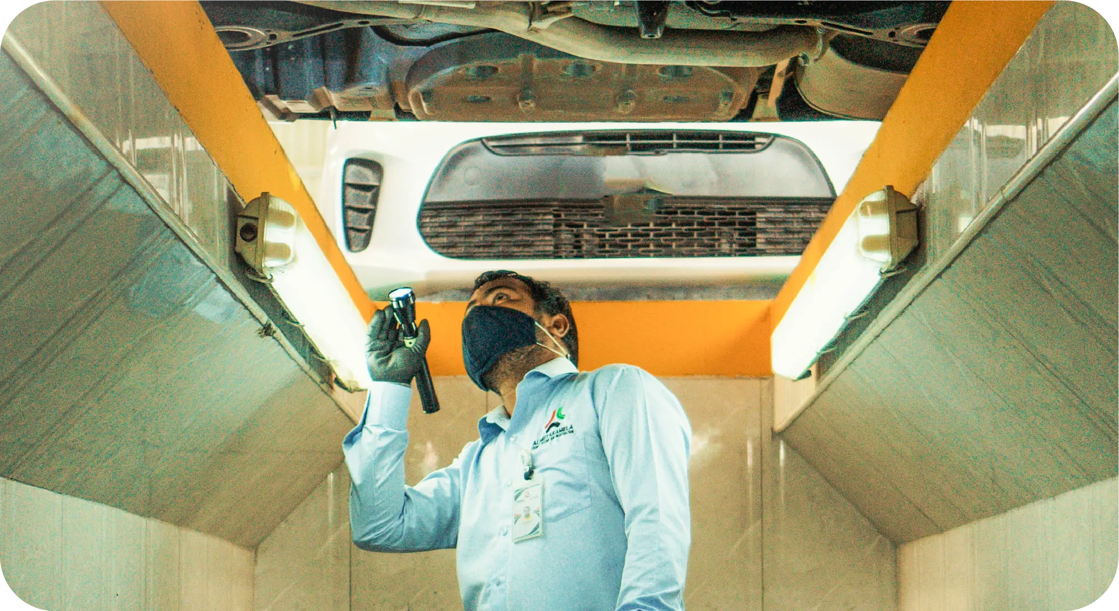 Technicians performing chassis inspection and repair